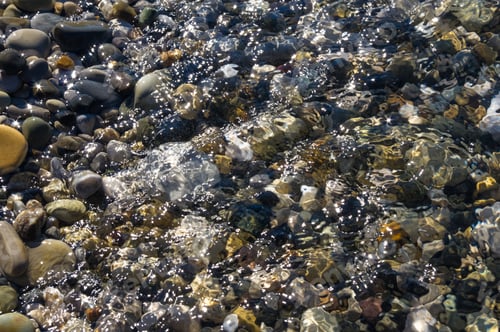 Preview: Sea Pebble Beach With Multicoloured Stones, Transparent Waves With Foam, On A Warm Summer Day