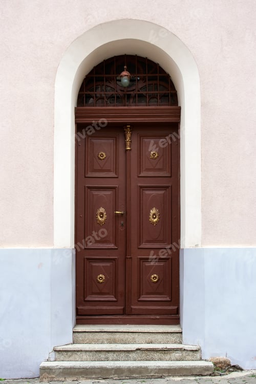 Preview: Old Church Wooden Door With Gold Trim, With An Arch, Grille And Lights, On The Cracked Concrete