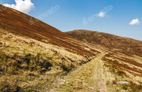 Preview: Road Through Mountains With Reddish Hills. Beautiful September Weather