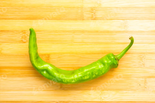 Preview: Still Life - One Cayenne Green Pepper On Wooden Board