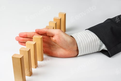 Preview: Hand Stopping Dominoes Falling Isolated On White Background