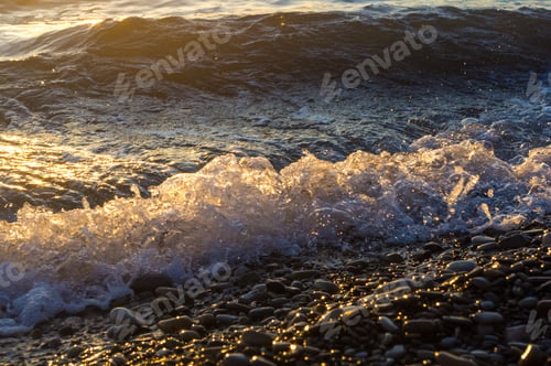 Preview: Sea Pebble Beach With Multicoloured Stones, Transparent Waves With Foam, On A Warm Evening