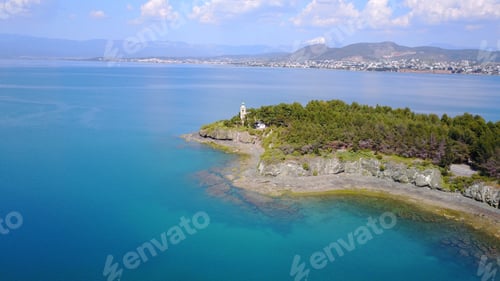 Preview: Aerial Photo Of Iconic Lighthouse In Small Vegetated Islet