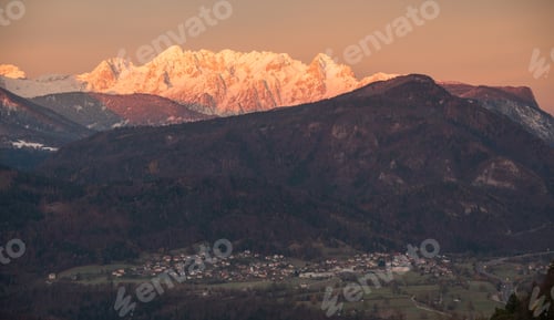Preview: Village Under The Mountain At Sunrise. Mountains Are Already Covered With Snow.