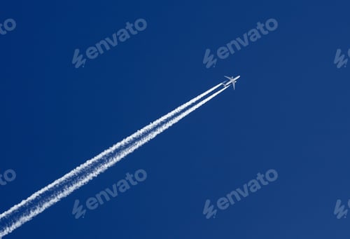 Preview: Aeroplane In The Clear Blue Sky Leaving Vapor Trails Behind