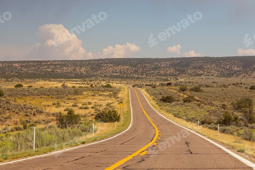 Preview: A Highway Runs Along The Red-Sandstone. Empty Road In Arizona, Usa.