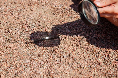 Preview: Hand With Magnifying Glass Igniting Wood Beam