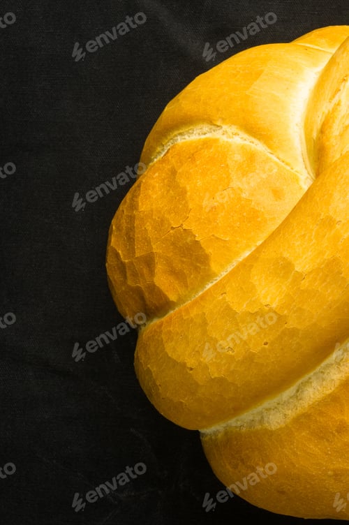 Preview: Fresh Braided Loaf Of White Wheat Bread On Black Background