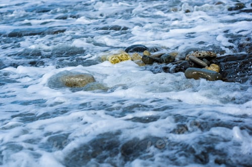 Preview: Pebble Stones On The Sea Beach, The Rolling Waves Of The Sea With Foam