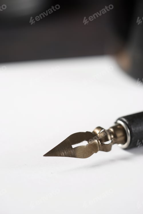 Preview: Nib Pen For Calligraphy And Inkwell On A Table.