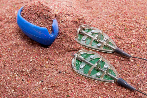 Preview: Close Up View Of Fishing Feeder. Dry Feed For Carp Fishing As Background For Different Fishing