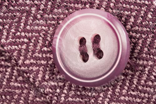 Preview: Macro Shot of a Purple Button and Fabric