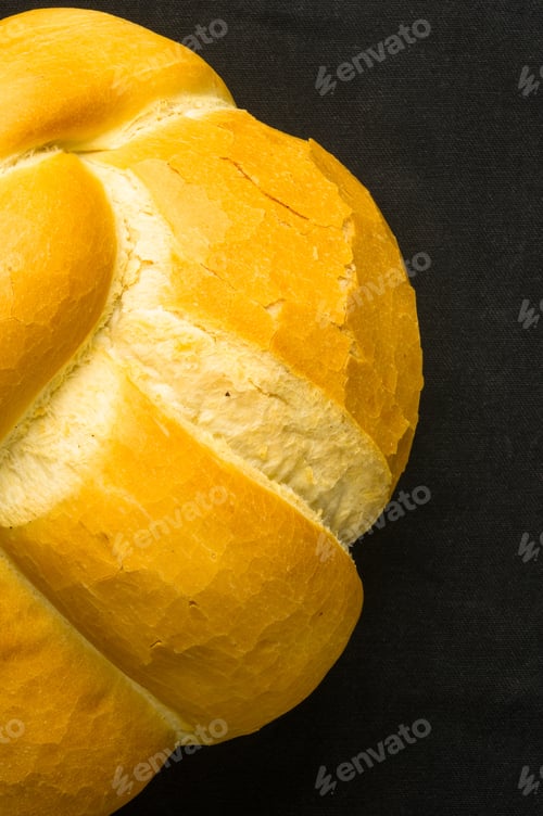 Preview: Fresh Braided Loaf Of White Wheat Bread On Black Background
