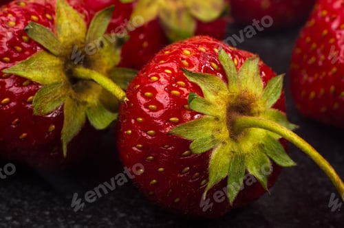 Preview: Fresh Ripe Berries Strawberries On Black Ceramic Plate On White Background, Macro Photo