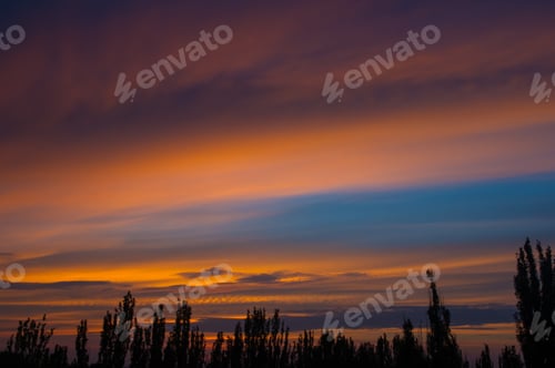 Preview: Landscape With Dramatic Light - Orange Clouds And The Outline Of Trees At Sunset