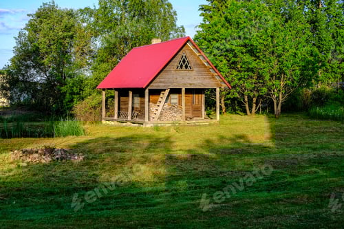 Preview: Abandoned Ruins Of Old Wooden Building In Latvia Countryside In Summer With Foliage