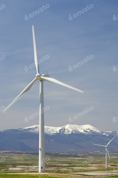 Preview: Wind Mills And Snowy Mountain With Blue Sky