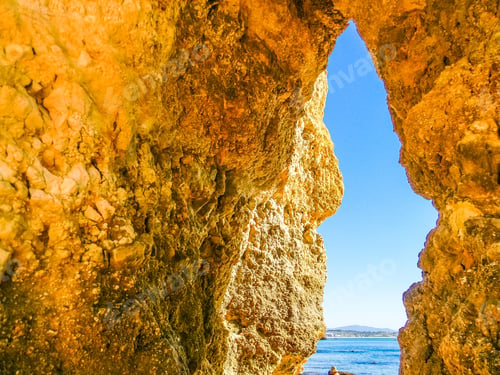 Preview: Rocky Ravine Of A Cave With Sight On The Ocean In Praia Dona Ana Beach In Lagos, Algarve, Portugal
