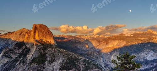 Preview: A Panoramic View Of Half Dome And Yosemite Valley. Golden Light From The Sunset Is Cast Upon The