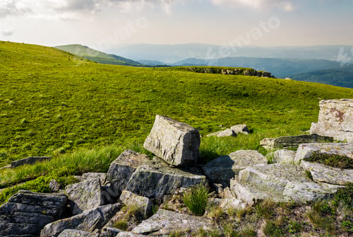 Preview: Rocks On Grassy Meadow On Top Of A Hill. Beautiful Summer Scenery In Mountains