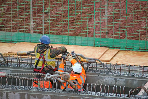 Preview: Construction Workers With A Bridge Beam