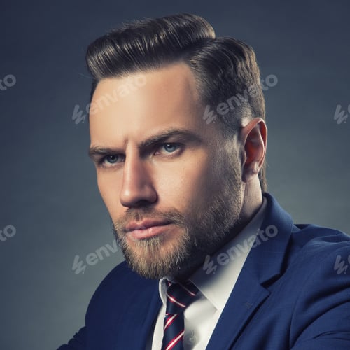 Preview: Young Handsome Bearded Caucasian Man With Blue Eyes. Perfect Skin And Hairstyle. Wearing Blue Suit