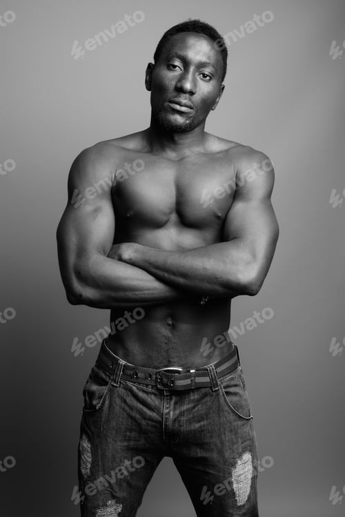 Preview: Young Handsome African Man Shirtless Against Gray Background