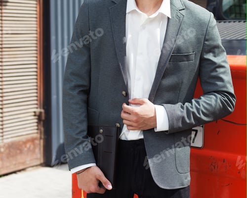 Preview: Part Of The Body. A Young Man In A Fashionable Gray Jacket Posing For A Fashion Magazine. Outdoor.