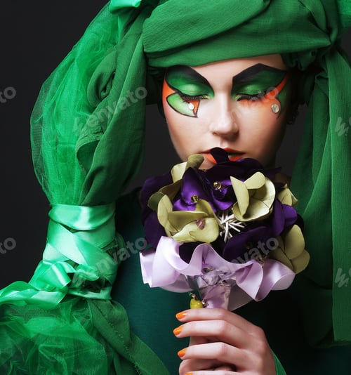 Preview: Young Woman With Creative Make Up Holding A Bouquet Of Jewelry