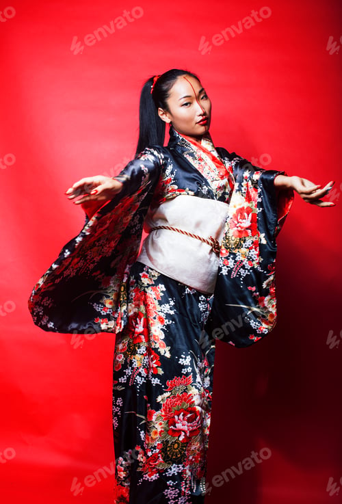 Preview: Young Pretty Geisha On Red Background Posing In Kimono, Oriental Concept