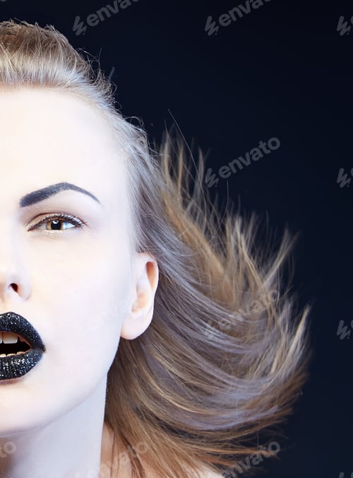 Preview: Dark Sparkle Lips Makeup & Windy Hair. Close-Up Portrait Of Female Caucasian Young Blonde Model