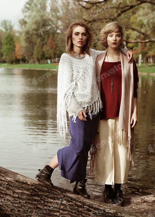 Preview: Photo Of A Two Beautiful Women Posing On A Tree Near Lake.