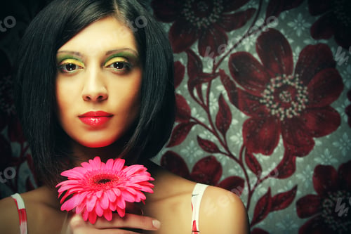 Preview: Young Beautiful Woman With Bright Make Up Holding Pink Gerber Flower