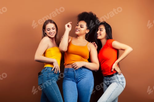 Preview: Young Pretty Multiracial Girls Posing Cheerful On Brown Background, Lifestyle People Concept