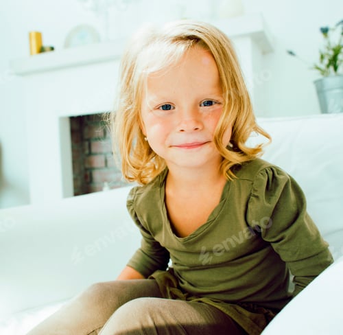 Preview: Little Cute Blonde Norwegian Girl Playing At Home With Pillows