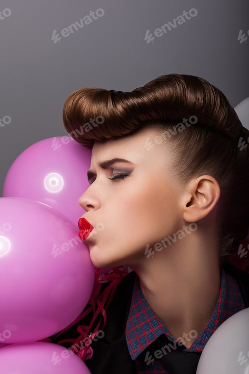 Preview: Emotional Comical Woman With Colorful Air Balloons Grimacing