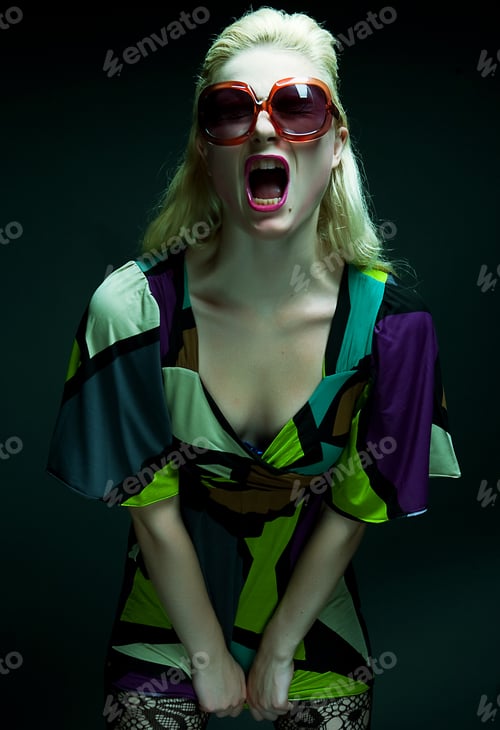 Preview: Young Woman With Sunglasses On Black Background