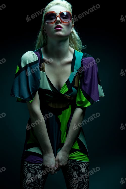 Preview: Young Woman With Sunglasses On Black Background
