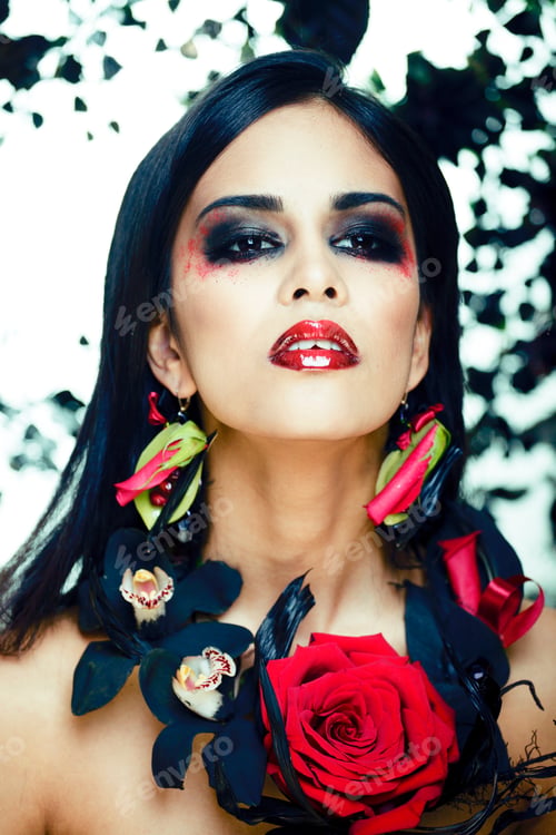 Preview: Pretty Brunette Woman With Rose Jewelry, Black And Red, Bright Make Up Kike A Vampire Closeup Red