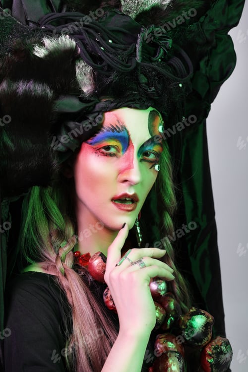 Preview: Fashion, Beauty, People And Halloween Concept: Young Woman With A Bright Creative Make-Up And A Big
