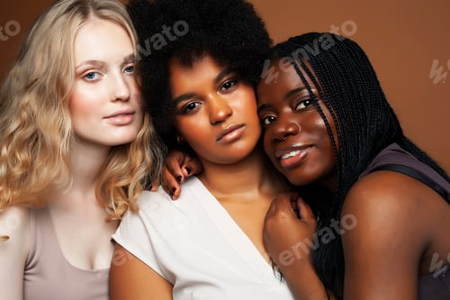 Preview: Young Pretty African And Caucasian Women Posing Cheerful Together On Brown Background, Lifestyle