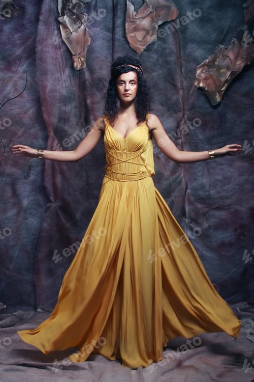 Preview: Beautiful Young Brunette Woman Wearing Yellow Evening Dress