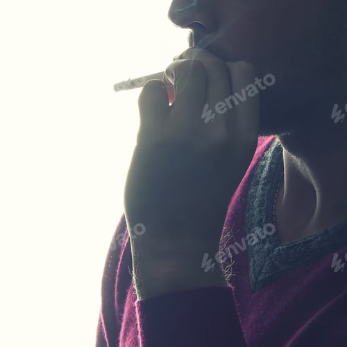 Preview: Close-Up Hand Silhouette Of Young Man Smoking A Cigarette Isolated On White Background. Studio