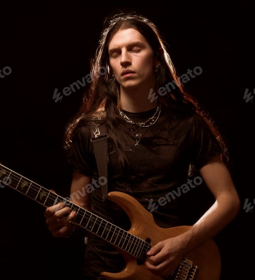 Preview: Man Playing Electrical Guitar. Wind In Hair.