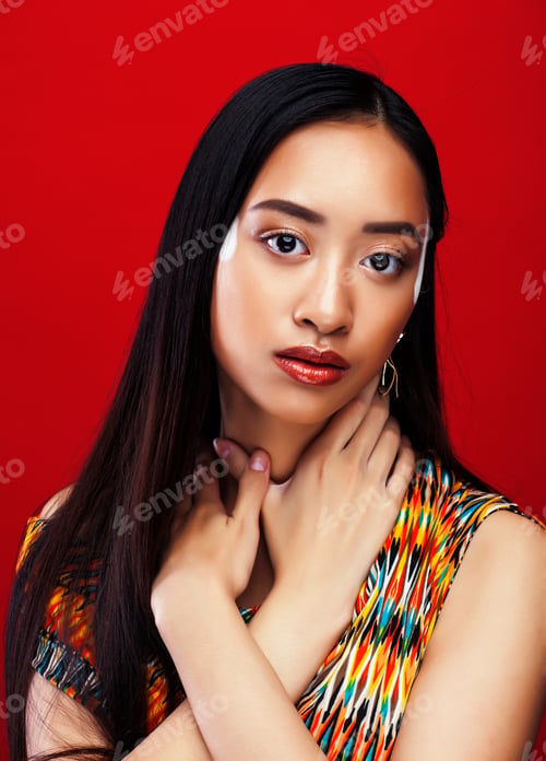 Preview: Young Pretty Asian Girl With Makeup Posing On Red Background, Li