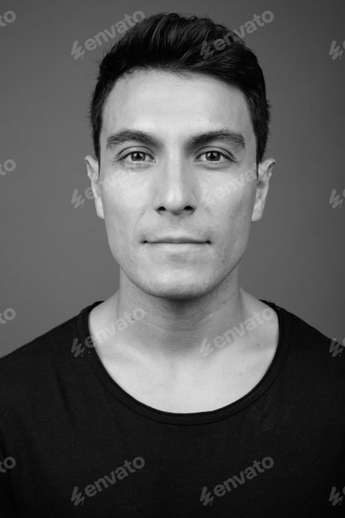 Preview: Young Handsome Hispanic Man Against Gray Background