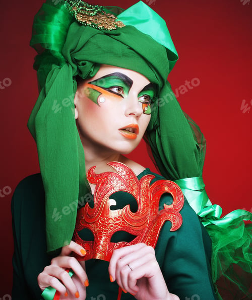 Preview: Portrait Of Young Woman With Mask In Creative Theatrical Image.