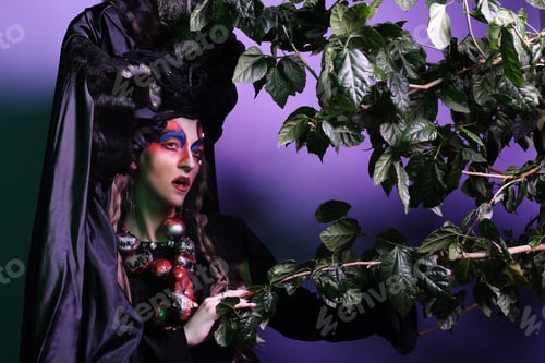 Preview: Fashion, Beauty, People And Halloween Concept: Young Woman With A Bright Creative Make-Up And A Big