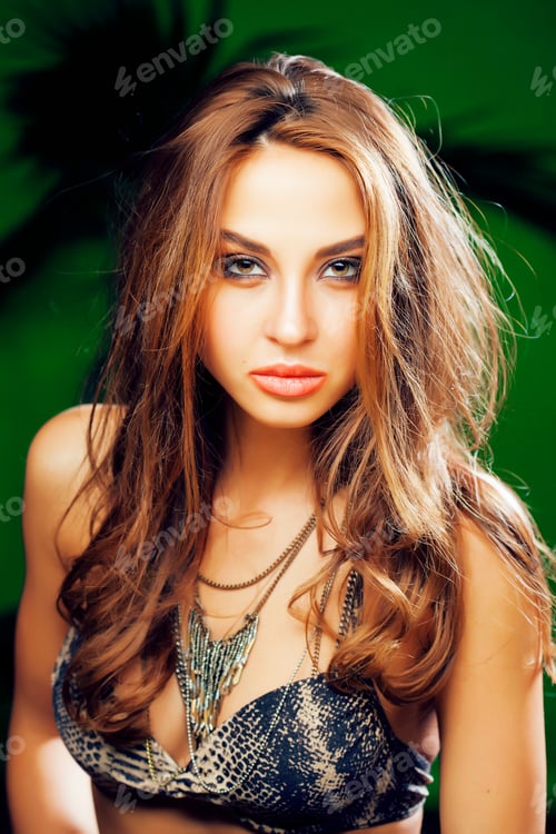 Preview: Young Cute Brunette Woman On Green Palm Background Smiling Happy