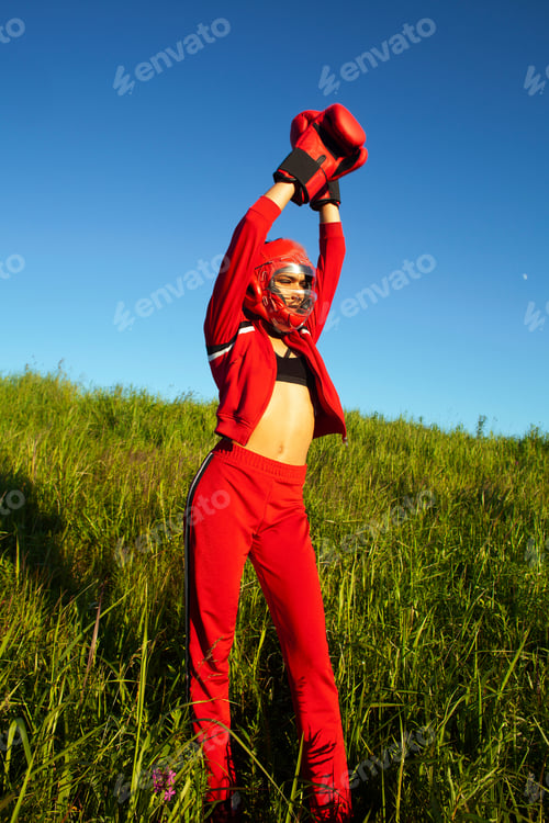 Preview: Pretty Swag Indian Girl Training Box Outside In Green Field. Lifestyle Sporty People Concept